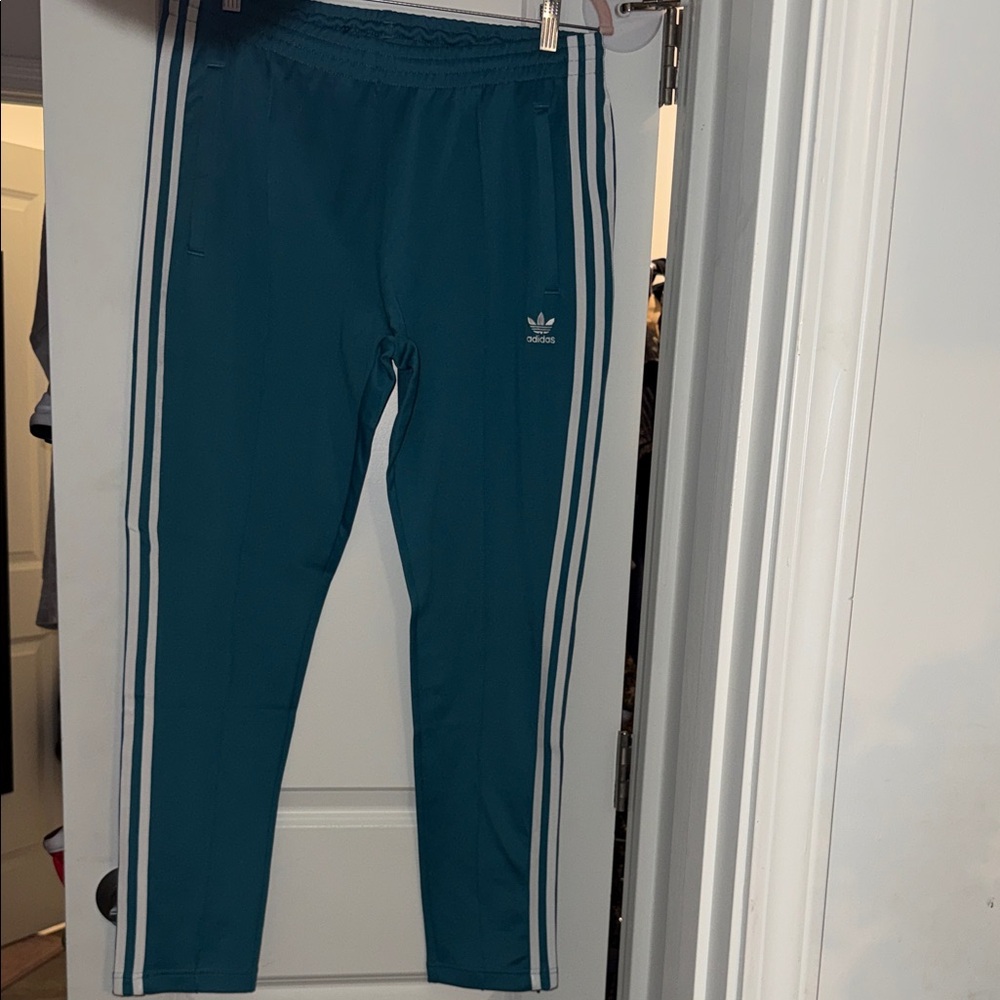 Adidas Teal Joggers with White Stripes. Unisex